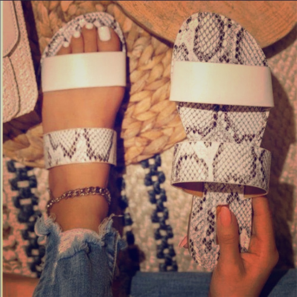 Snakeskin print varies on each sandal Size 7